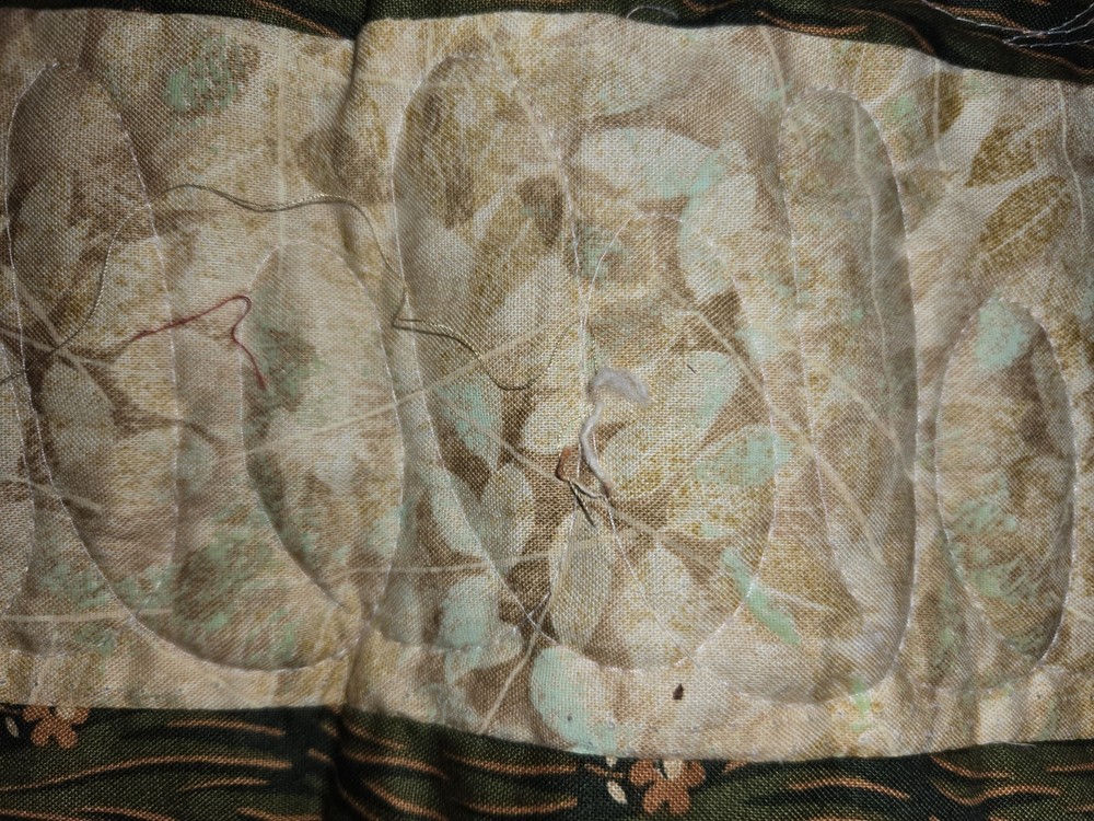 QUILT. 78X96. MACHINE QUILTED. 100 DIFFERENT PATTERNS