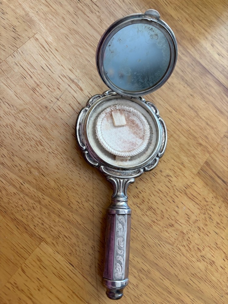 silver hand held mirror compact