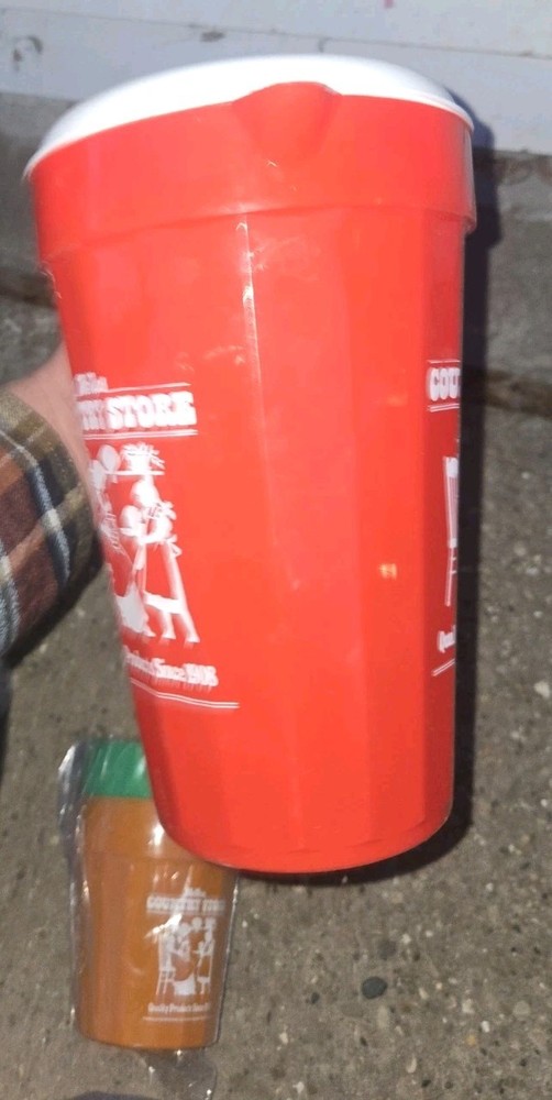 McNess Country Store. Plastic Pitcher And 4 Plastic Cups