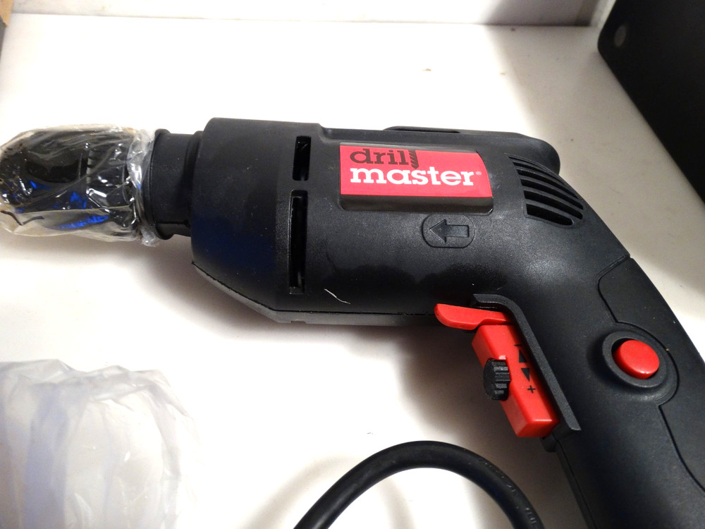 Drillmaster 3/8’” Variable Speed Reversible Corded Drill - NEW