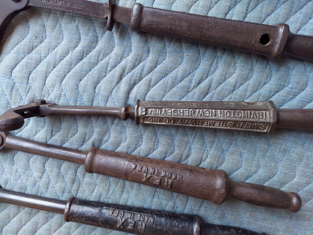 Collection of 8 different antique nail pullers