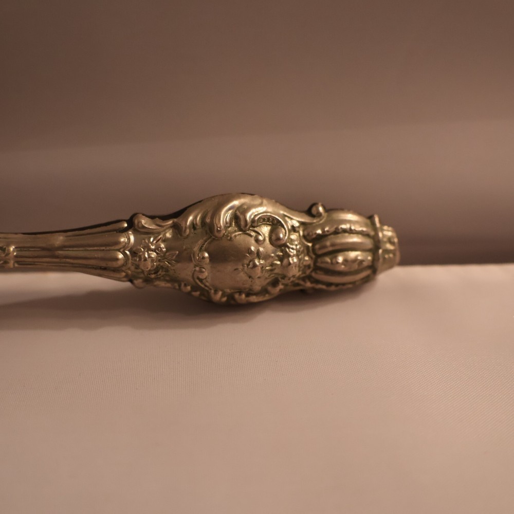 Darner with silver handle