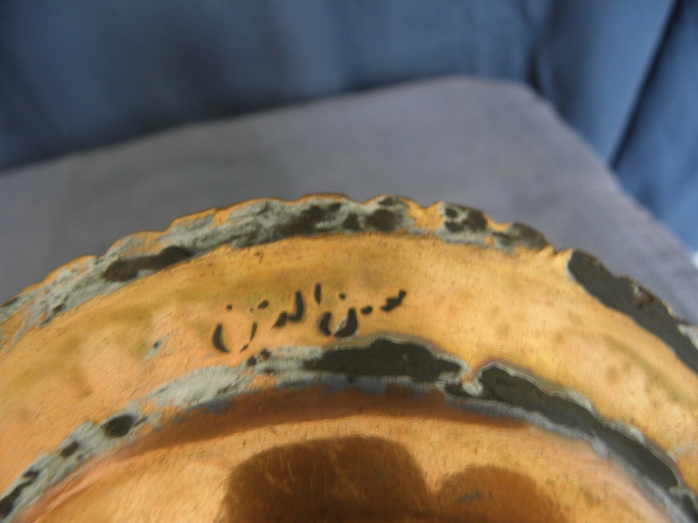 Pair of copper Middle Eastern dishes, both signed