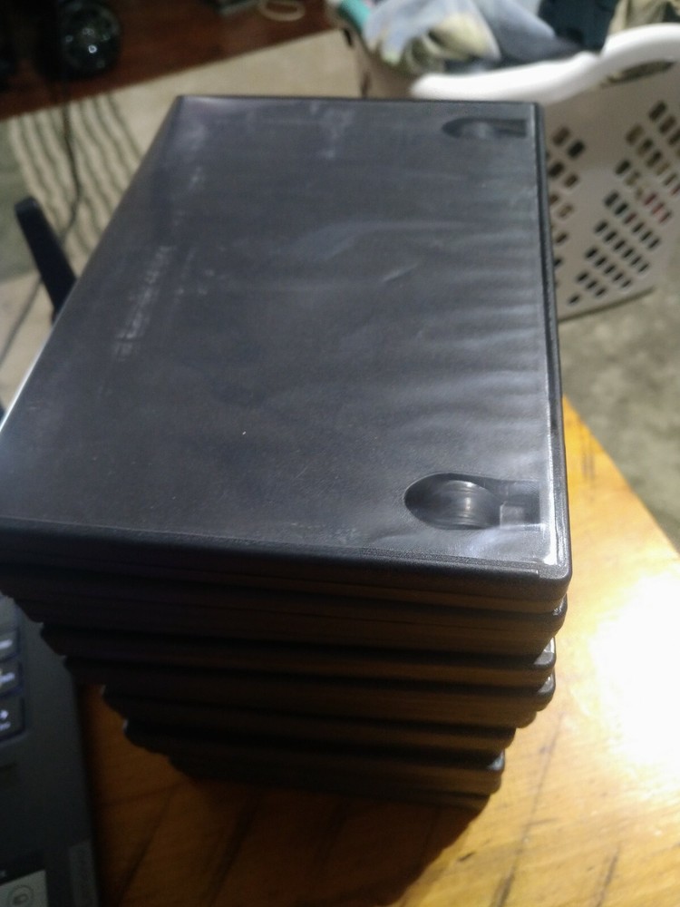 15 Empty DVD Cases - plastic covers are still intact.