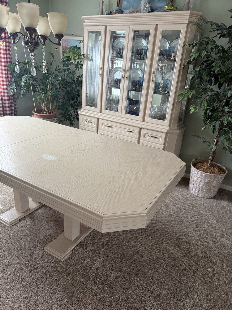 dining room set 6 chairs and lighted hutch ,table has leaf stored inside