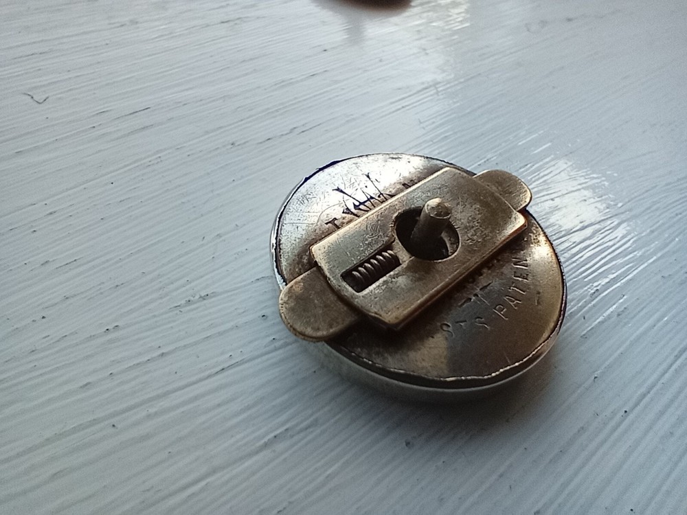 Ornate Victorian silver plated lapel badge