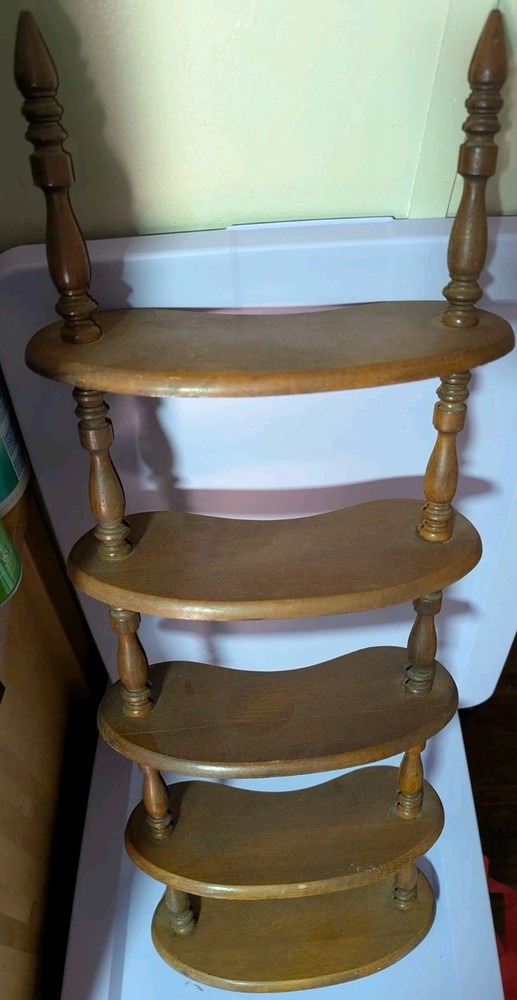 vintage wood spindle shelf or possibly spiral library steps.