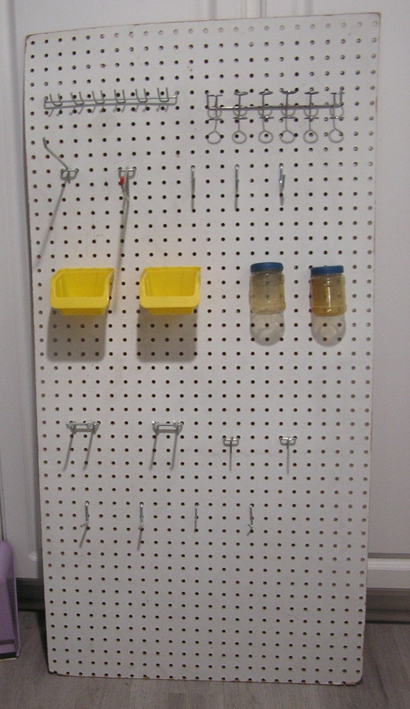 Composite Pegboard with Hooks and Bins Moounted
