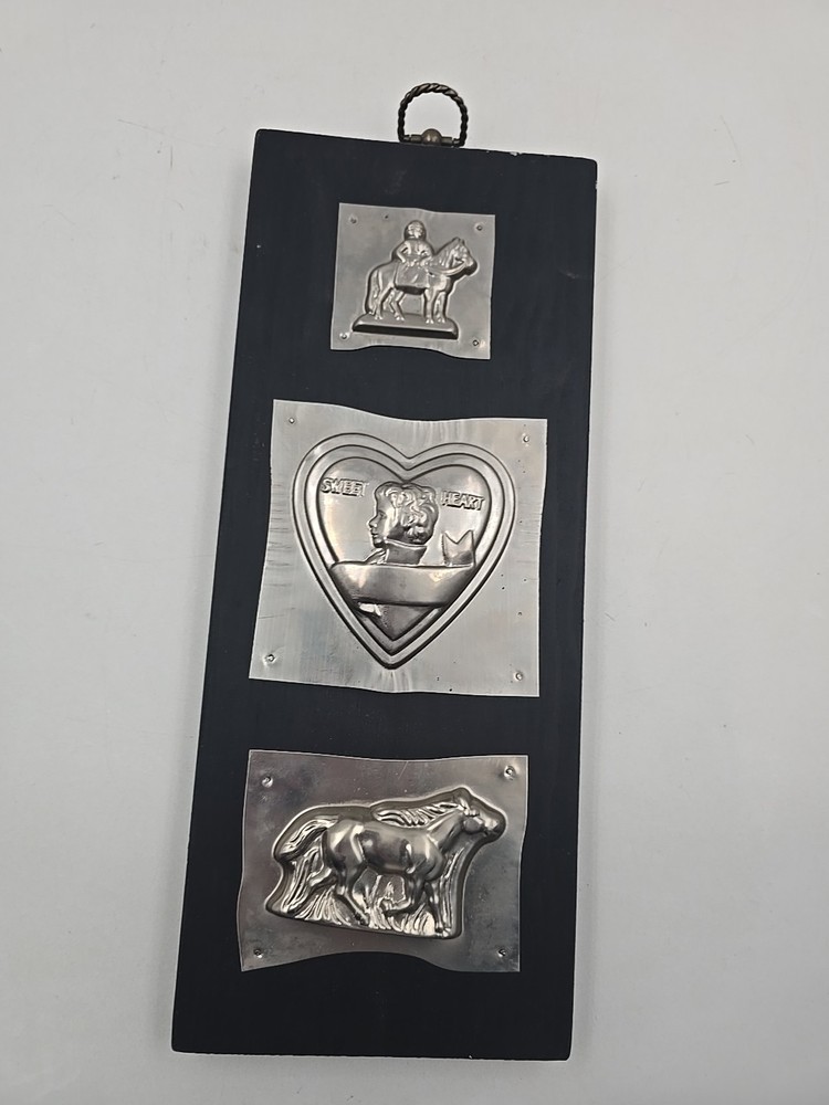 Chocolate Tin Molds On Wood Wall Hanging Display