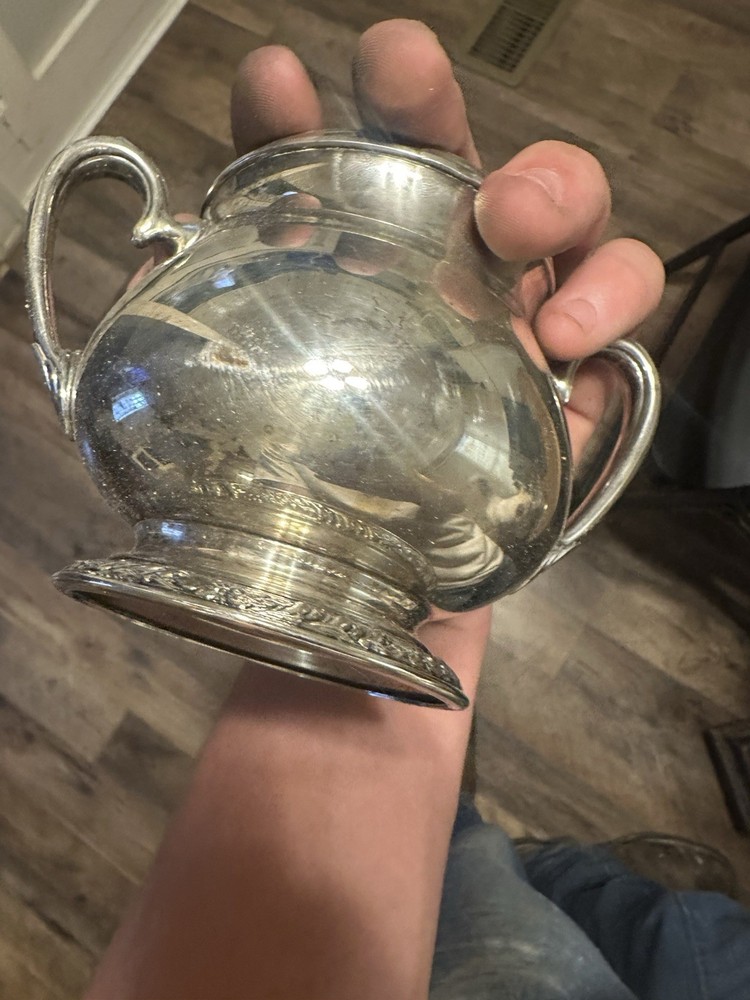 Set Of Four Silver Plated Cups.