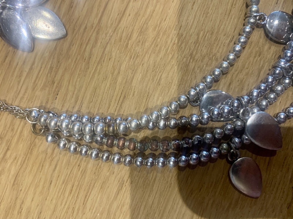 Silver tone multi layered necklace set. Some tarnish as shown