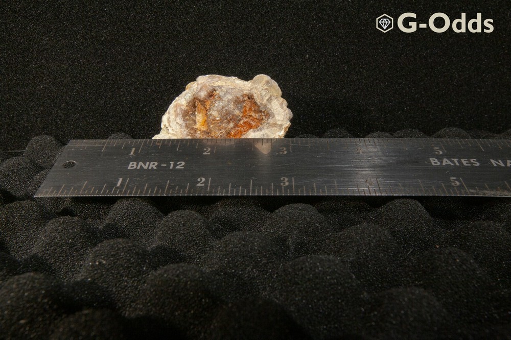 Rare broken geode around 2" with iron oxide and quartz
