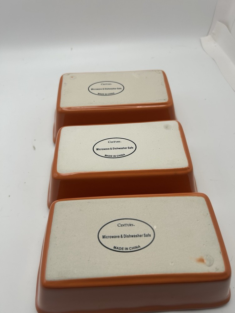 3 Stoneware Loaf Pans With Scalloped Edges.
