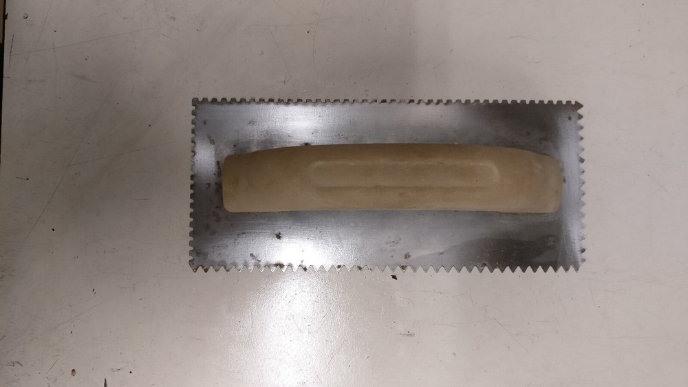 Eight assorted drywall/mud tools