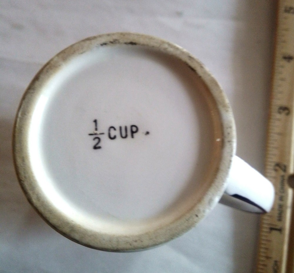 Porcelain Creamer 1/2 Cup marked on Bottom.