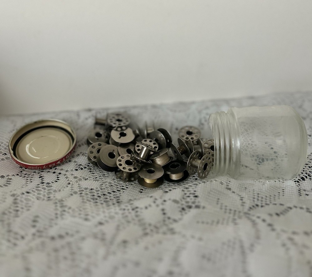 Jar Of Metal Bobbins Some Used Some With Thread