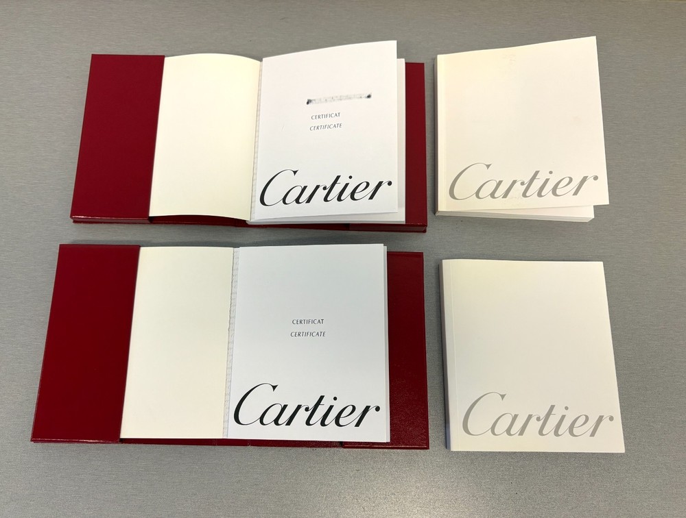 Two Cartier Original Certificate & Instruction Booklet's