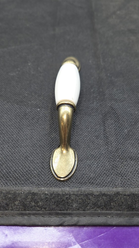 Antique Brass Deco Base Cabinet Pulls White 3 in. Center-to-Cente