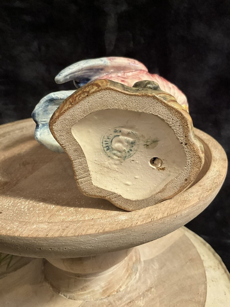 Vintage 6” pink & blue parrot on green tree stump