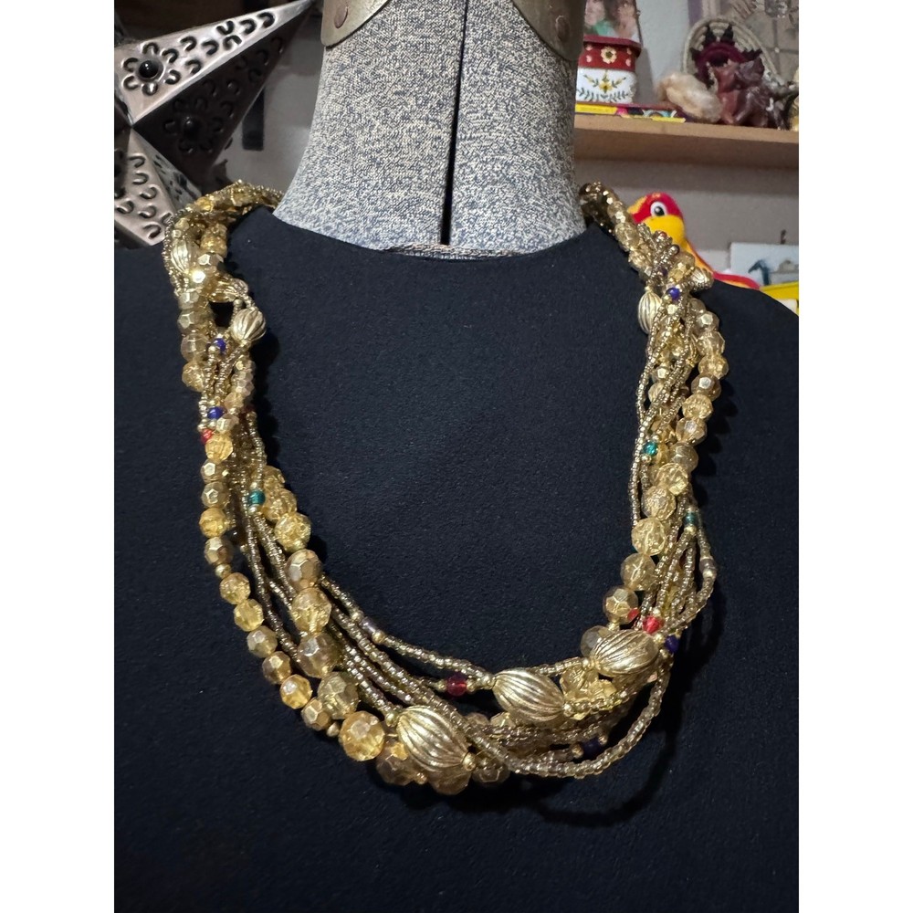 Layered gold statement necklace with major texture and movement
