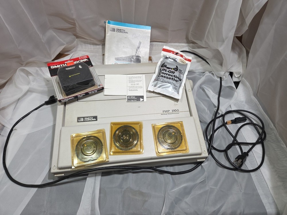 Smith Corona PWP 3100 Word Processor with accessories, manual, ribbons, and type