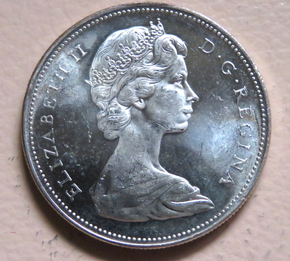 Canada. 1965 Silver - 1 Dollar.. intermediate beads, blunt 5.. BU