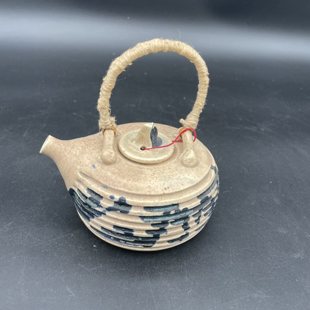 Small Tea Pot Blue & White Pottery w/ Yarn Handle.