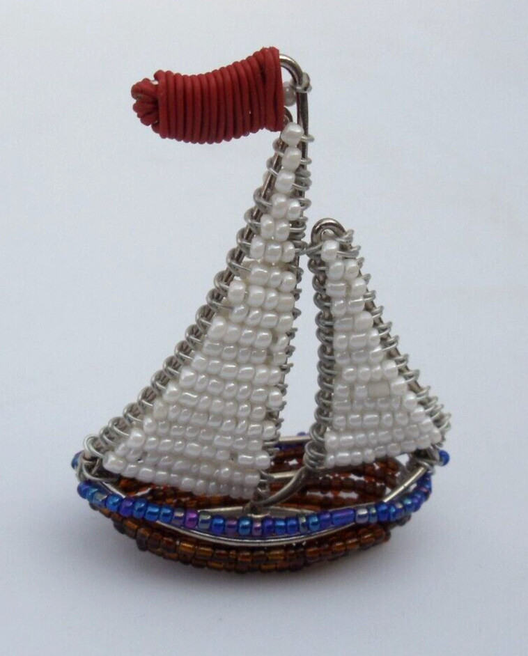 Beaded sea: Miniature sailboat