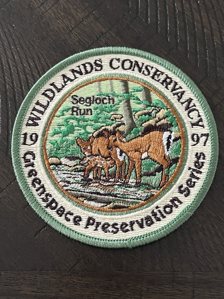 1997 WILDLANDS CONSERVANCY PATCH 4" DIA “SEGLOCH RUN”