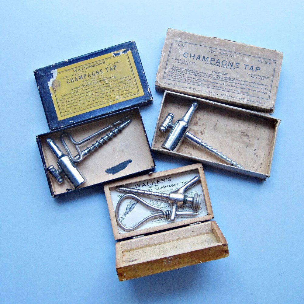 Three boxed champagne taps