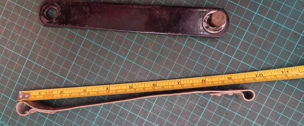 BSA battery Strap and piece of tin ware