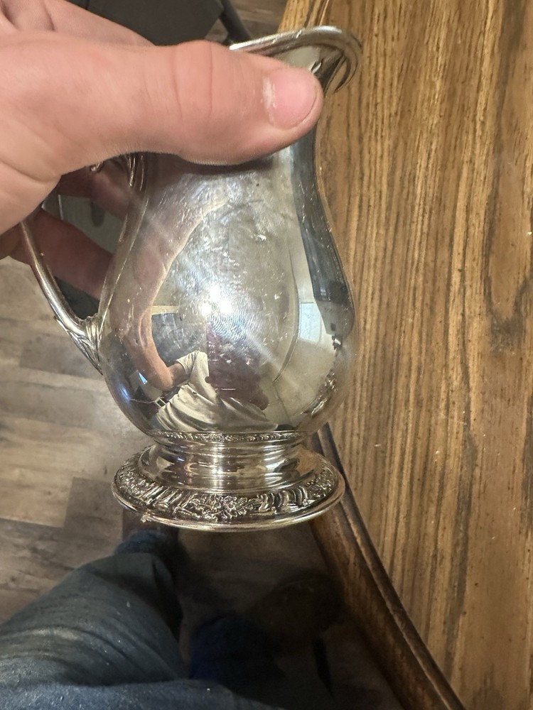 Set Of Four Silver Plated Cups.