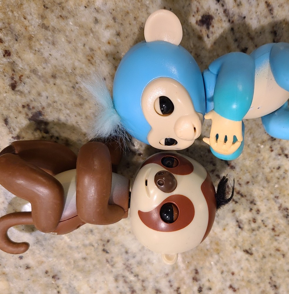 2 Fingerlings Interactive Baby Monkey Blue Brown Toys. Both work tested.