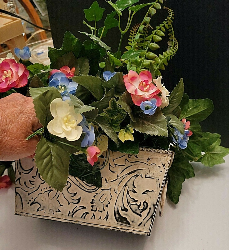 CREAM TIN RECTANGULAR PLANTER WITH HANDLES FILLED WITH FLOWERS