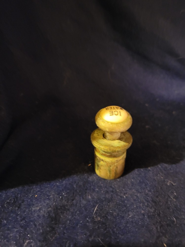 Antique cold water actuator for hotel sink.