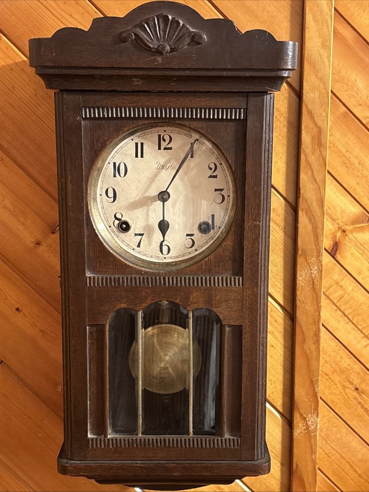 Vintage spring pendulum clock made by Meiji Clock Co.