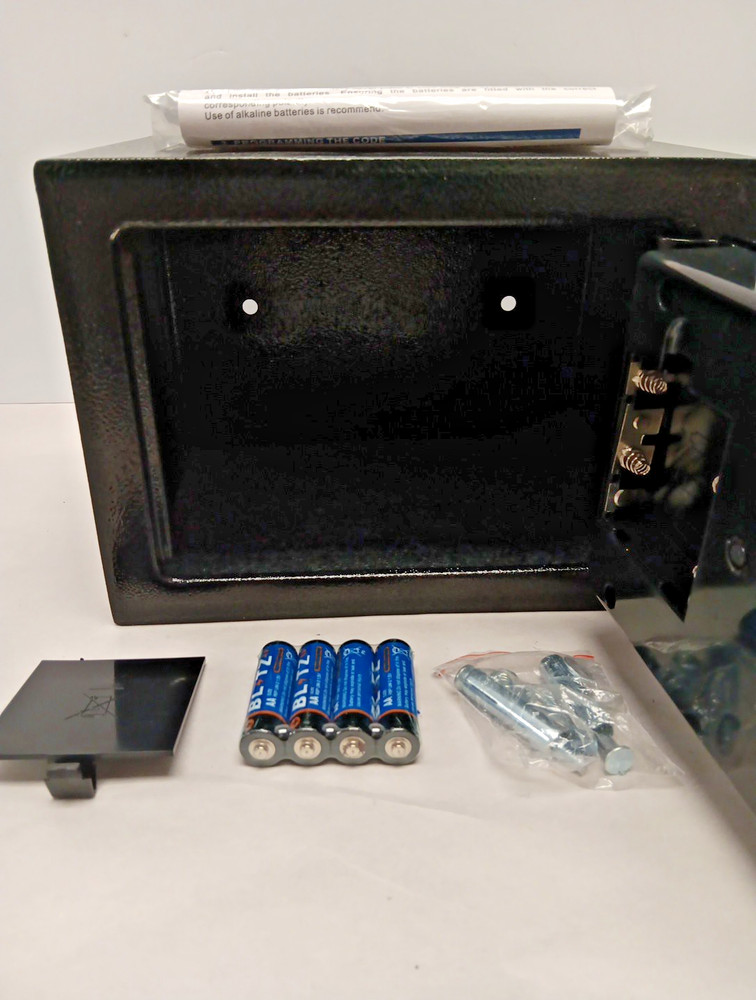 electronic security safe box with a keypad and key access.
