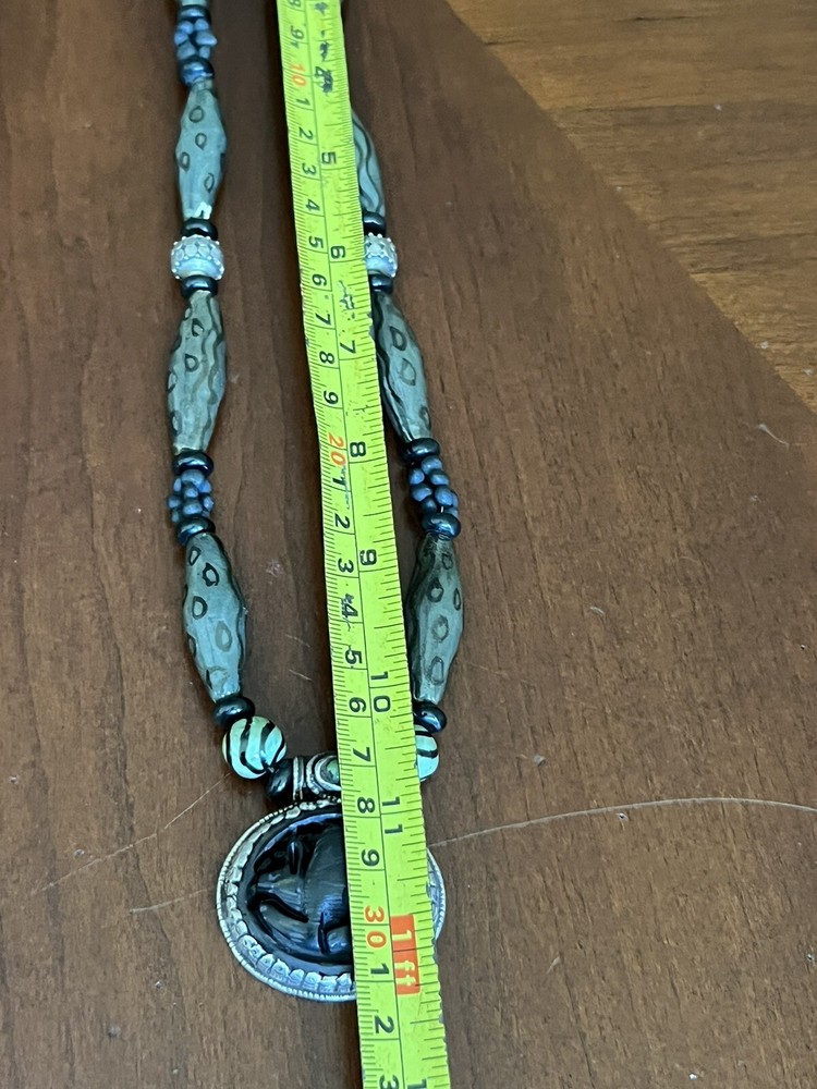 hand crafted beaded necklace Whit Carved Pendant