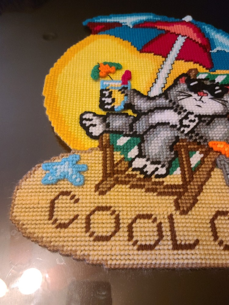 Cross stitch cat at beach on plastic canvas. 3D.