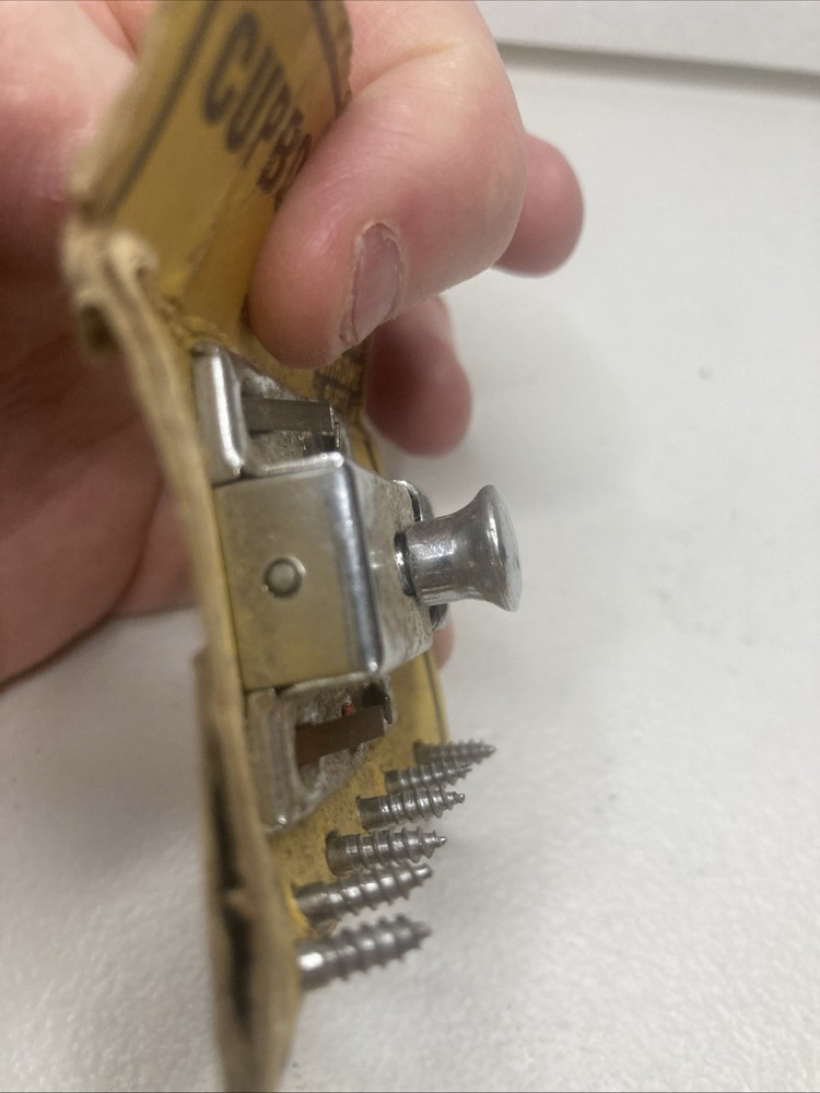 NOS- vintage chrome-plated cupboard catch.