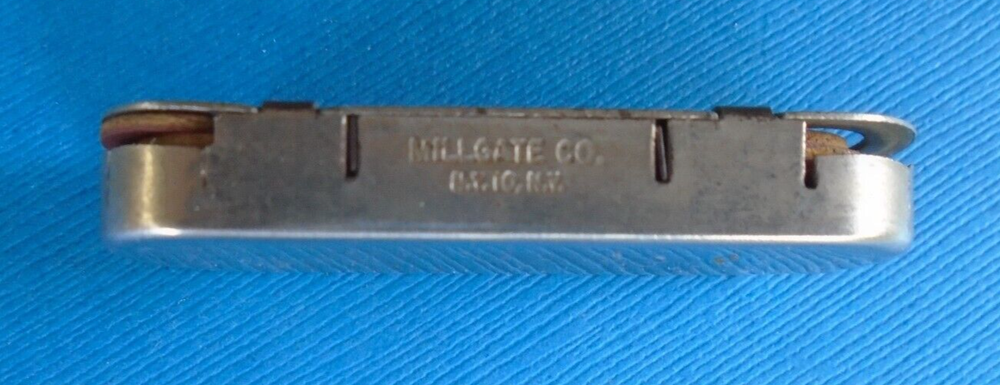 WWII home front ration token holder, made by Millgate, with some tokens