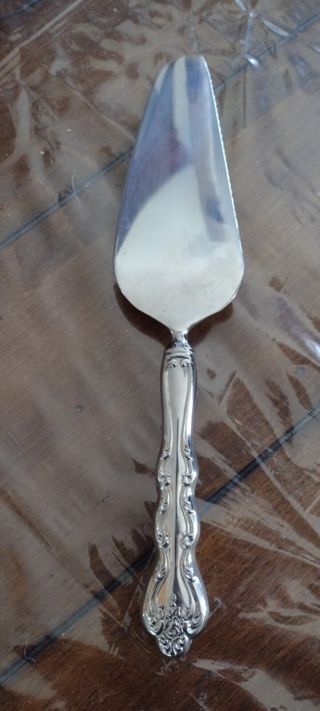 Pie/Cake Server Serrated Edge on one side with ornate design handle