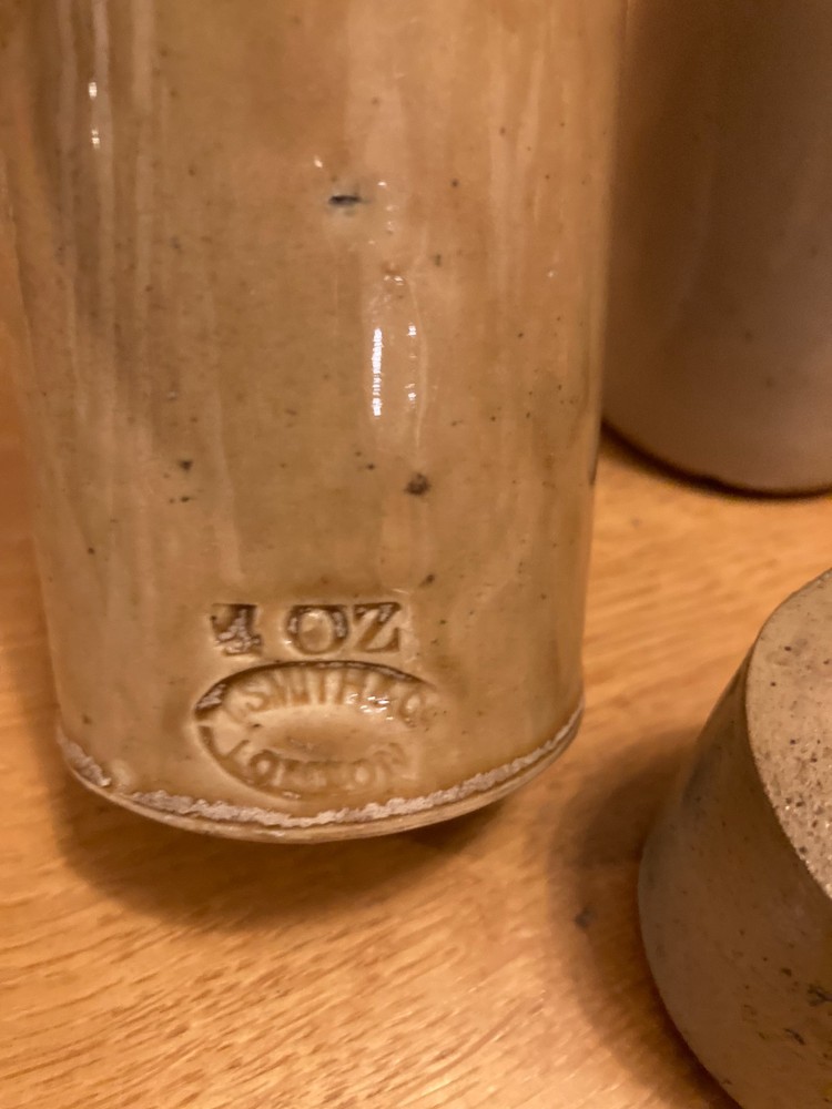 Vintage stone bottle collection in decent condition.