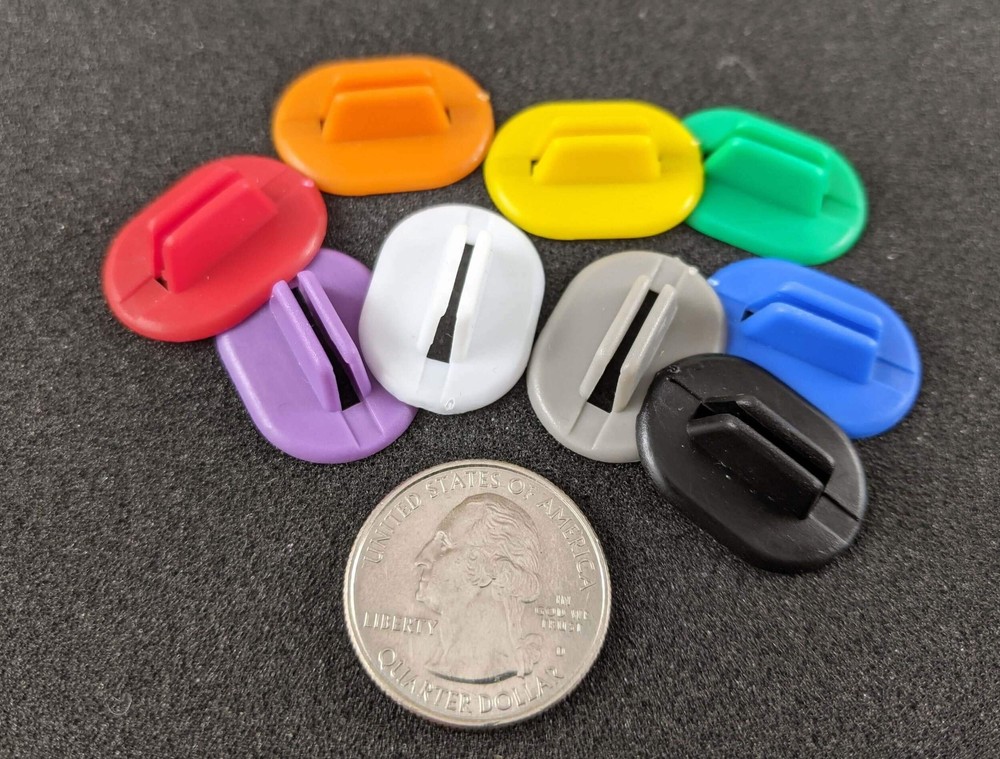 Flexible plastic stands for board game pieces