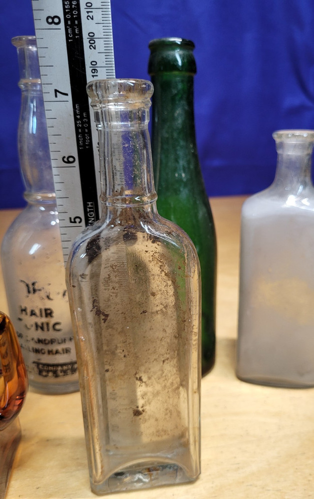 7 Vintage Bottles, 1 with Stopper