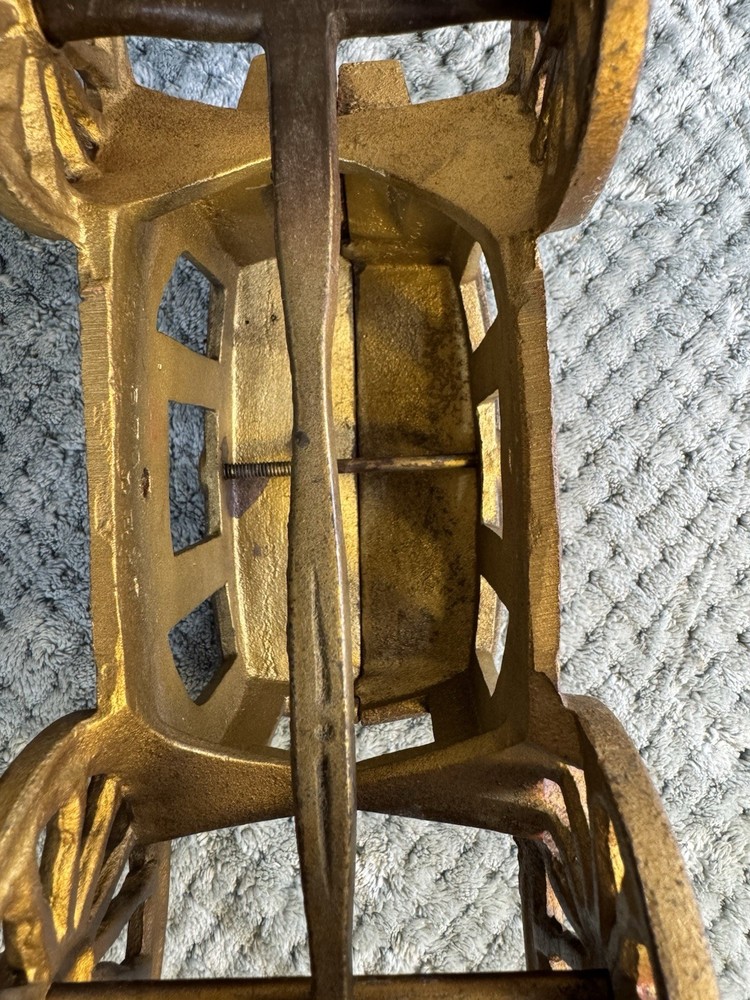 Antique cast iron pull toy carriage with decorative detailing and pull handle