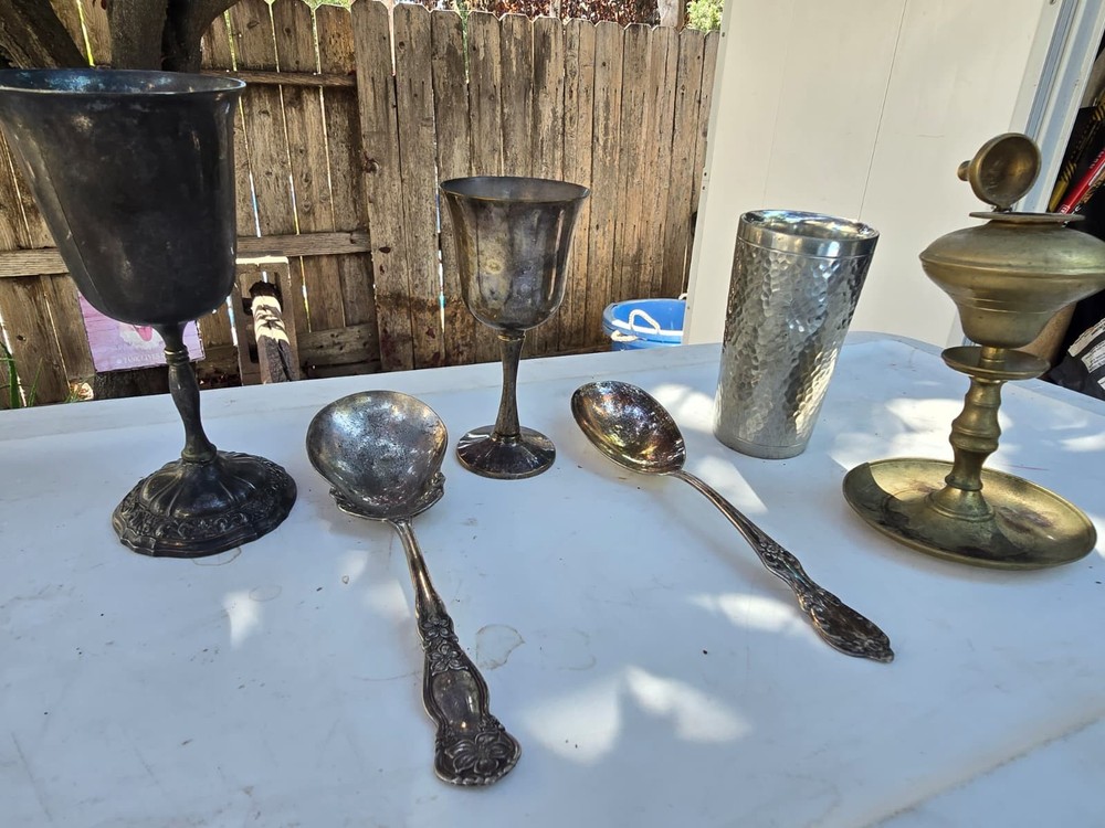 sterling silver chalices, silver spoons, silver cup, and incense holder.