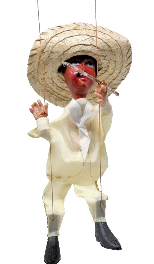 traditional mexican marionette puppet with plastic guns