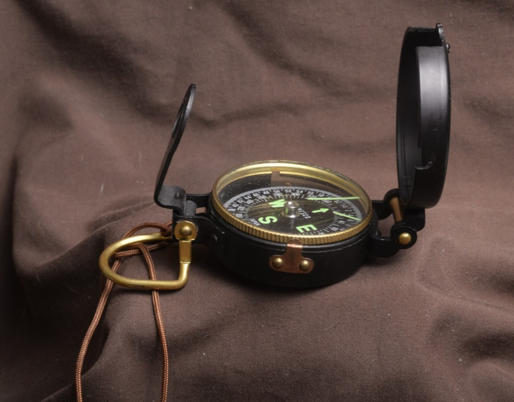 two lensatic compasses one with box