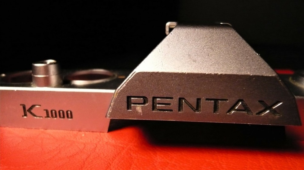 Pentax K1000 top cover plate, 3rd generation Plastic/China.